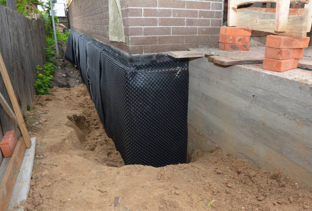 Happy homeowners after waterproofing job in Waldo